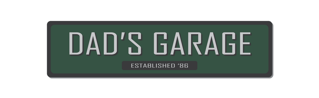 Metal Dad's Garage sign green with grey text