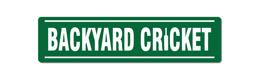 Front view of backyard cricket sign. Green with white text