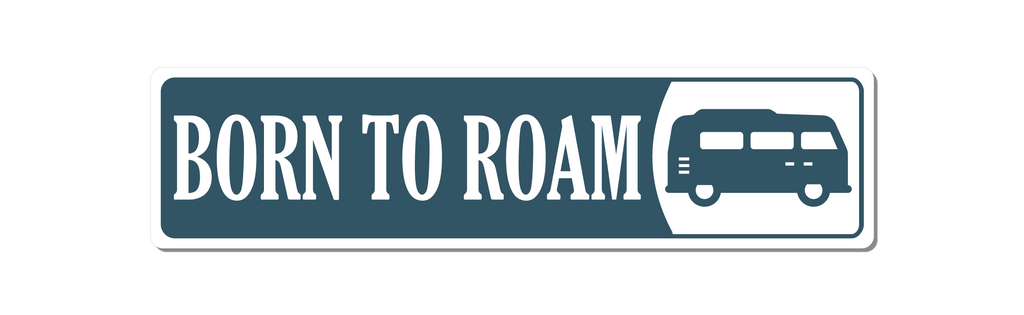 Blue with white text Caravan or camping sign. Text says Born to Roam with an image of a camper van to the right of text